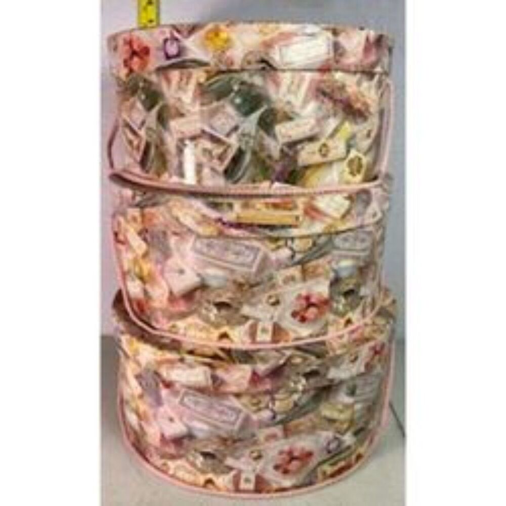 3- 15" round floral decorative print nesting hat boxes with pink handles